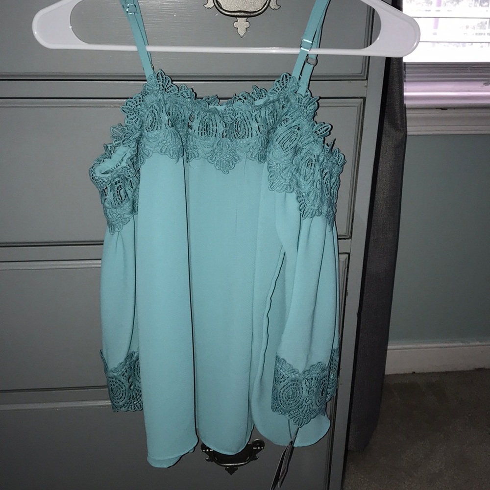 Turquoise shirt with lace detailing